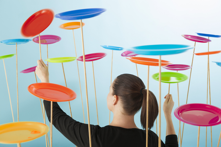 woman juggling plates